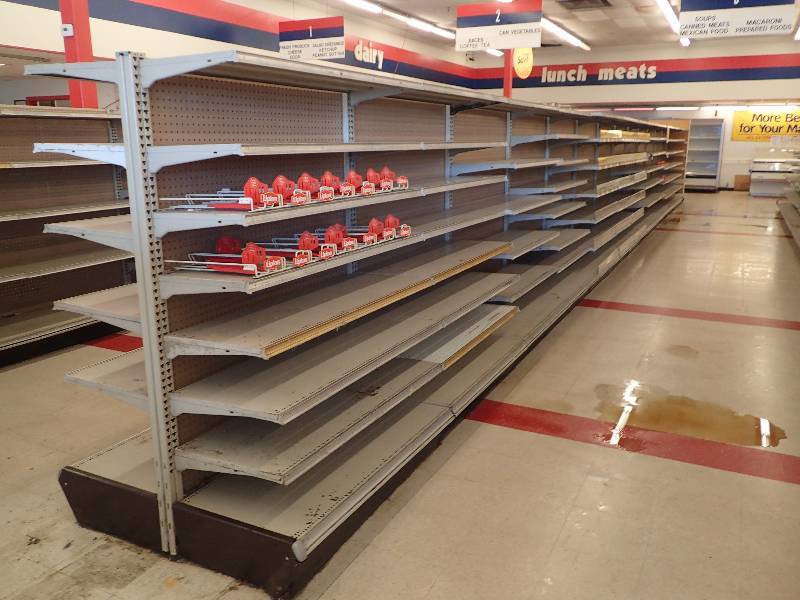 lot 4241 image: Entire Row of Adjustable Double Sided Merchandise Shelving