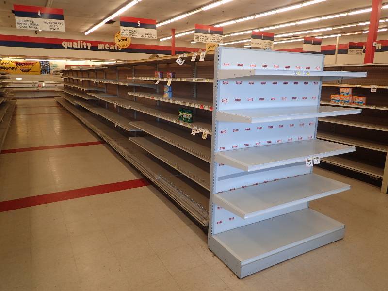 lot 4243 image: Entire Row of Adjustable Double Sided Merchandise Shelving