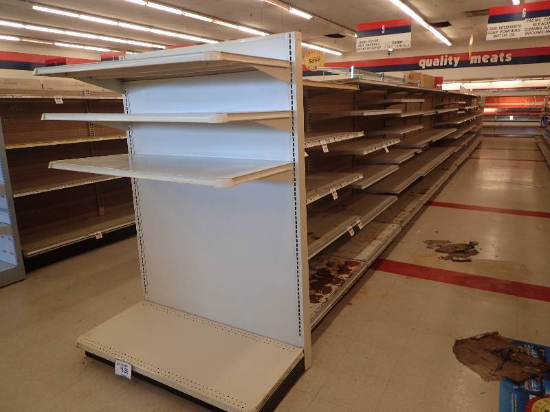lot 4244 image: Entire Row of Adjustable Double Sided Merchandise Shelving