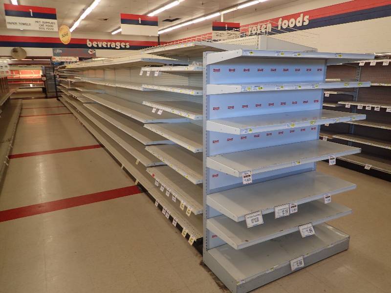 lot 4246 image: Entire Row of Adjustable Double Sided Merchandise Shelving