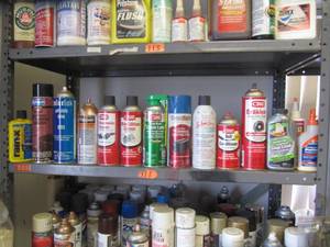 lot 3156 image: EVERYTHING ON SHELF - ENGINE CLEANER, CHAIN LUBE, STOP LEAK, BATTERY TERMINAL PROTECTER