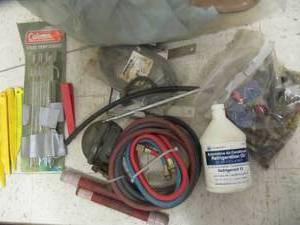 lot 3204 image: MISC. AC HOSES & CONNECTORS, TENT STAKES, REFRIGERATOR OIL
