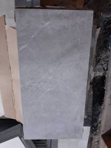 lot 63 image: 12 X 24 BEIGE Porcelain Tile (Approx. 75SF)