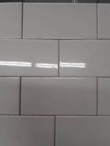 lot 86 image: 3 X 6 BRIGHT WHITE Ceramic Subway Tile (Approx. 51SF)