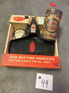 lot 49 image: Electric Putting Cup and Vintage Baking Powder Tin