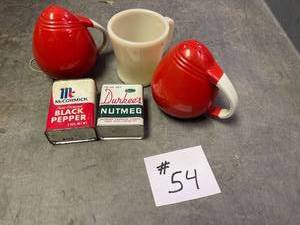 lot 54 image: Misc Lot of salt pepper shakers red and white, vintage spice tins, fire king ivory mug,