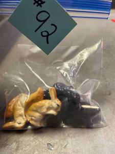lot 92 image: Porcelain squirrel and skunk Salt and Pepper Shakers
