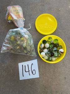 lot 146 image: Cup and Bag Full of Marbles