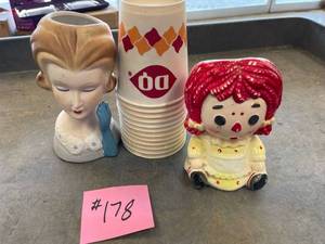 lot 178 image: Dairy queen wax cups, Vintage head vase, raggedy Ann planter