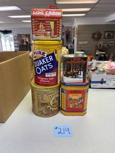 lot 219 image: vintage advertisement tins, log cabin, Quaker oats, maple syrup, rudds sunshine candies, country cookies