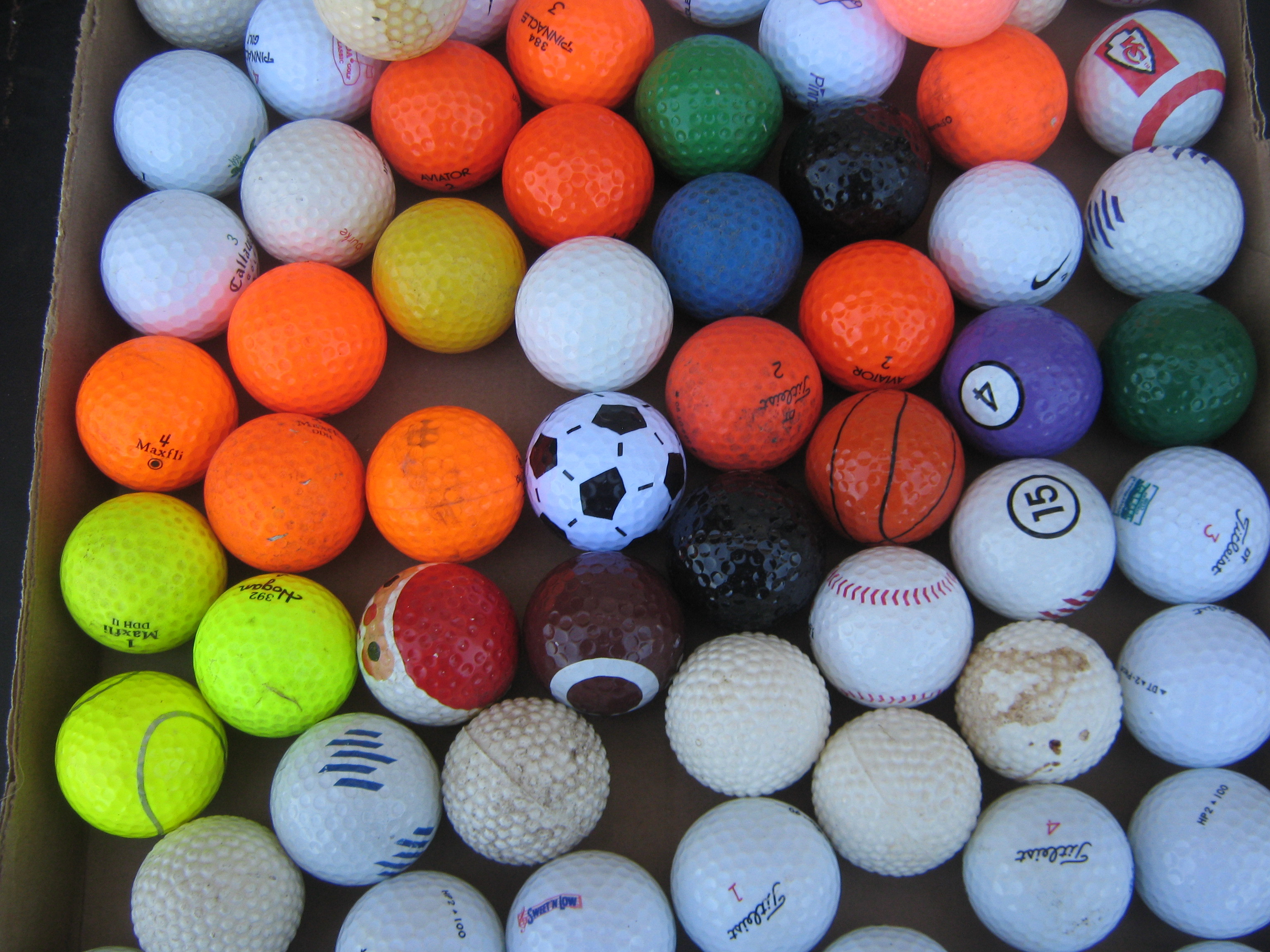 Large lot of golf balls over 100+ specialty and colored balls for
