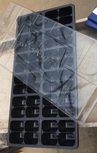 lot 55984 image: Three-piece seed starting kit. Bottom tray with growing cells and dome top.