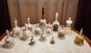 lot 113 image: Hand Bells  Norman Rockwell, Gorham, Holly Hobbie and Various others  up to 9 in. tall