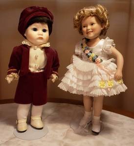 lot 122 image: Porcelain & Vinyl Portrait Baby Dolls  No Box  one is Shirley Temple  10.5 in. tall wstands