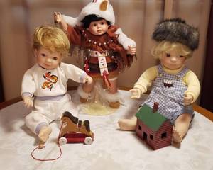 lot 123 image: L. Steele Porcelain Portrait Baby Dolls wAccessories  No Box  up to 13 in. tall