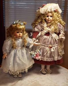 lot 125 image: Porcelain Portrait Baby Dolls  No Box  17 & 22 in. tall
