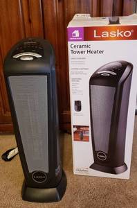 lot 164 image: Lasko Ceramic Tower Heater wremote  23 in. tall  powers on