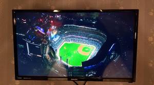 lot 175 image: Philips 24 in. Digital HDMI TV wRemote & Wall Mount and 2 GE Crystal HD Amplified Antenna  must remove from wall