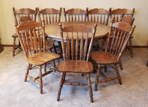 lot 342 image: Solid Wood Double Pedestal Laminate Top Table (48x 48x29 in. tall) w2 Captains & 8 Side Chairs - all Oak  includes Seven 14.5 in. Leaves