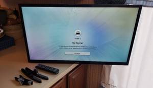 lot 375 image: Samsung 32 in. LED TV WArm Mounting, Remote and TV stands  Winning Bidder must remove from wall wo damaging wall