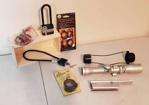 lot 438 image: Gun locks, scope mounts, & scope covers, Tasco scope 1.25-4x28 with mount