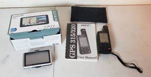 lot 445 image: Magellan GPS 315 and Garmin nuvi 2797 LMT wAccessories