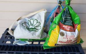 lot 845 image: Plant Mates Manual Grass seeder, with 2 partial bags of seed