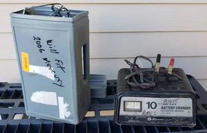 lot 854 image: 10 Amp Twin rate Battery Charger, & set of Tire Traction cables.