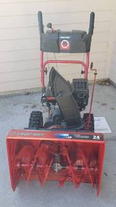 lot 863 image: Troy-Bilt Storm 2410, Two-stage Snow Thrower, has compression