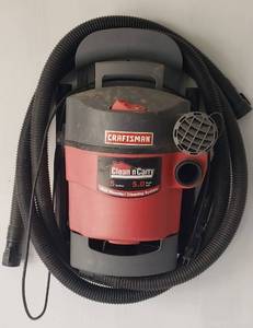 lot 870 image: Craftsman 5 Gallon Clean n Carry WetDry Vac with wall mount - Buyer must remove from wall without damage