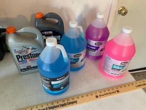 lot 890 image: Full Jugs of Windshield washer fluid & RV Antifreeze, Partial jugs of Preston Antifreeze