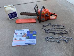 lot 893 image: Husqvarna 240 Chainsaw, Bar & Chain oil, 3 extra blade chains