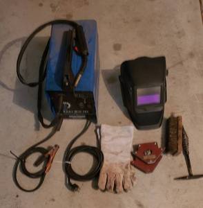 lot 910 image: Mig-100 Welder with Thermal overload, & Chicago Electric systems Auto-DarkeningWelding helmet, & welding accessories