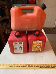lot 937 image: 2 - 2 Gallon Gas cans - 34 full, 1 2 Gallon gas can 18 full