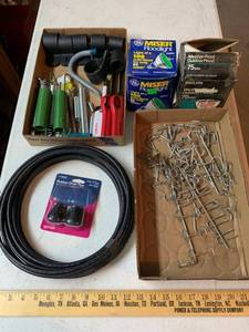 lot 942 image: Coax Cable, Springs, Pegboard hooks, floodlight bulbs, lighters, post clamps