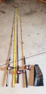 lot 960 image: 3 Fishing Rods with Reels & Bass Pro Shop sleeve