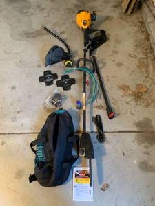 lot 984 image: Poulan PRO Trimmer, with Chainsaw attachment, extra blades, cord, Shoulder strap, oil. carry case