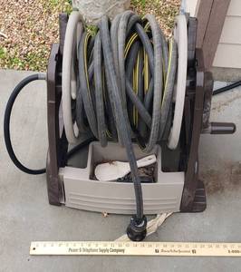 lot 1015 image: Ames Plastic Hose Reel and hose