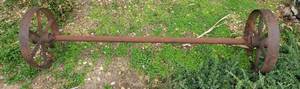lot 1022 image: Metal Wheels on Axle  76 in. long