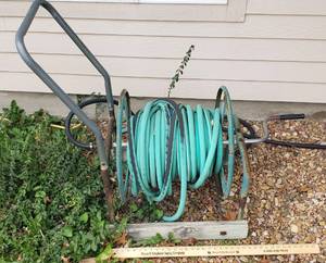 lot 1023 image: Metal Hose Reel and Hose