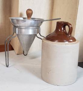 lot 617 image: Vintage Strainer on stand, Crockery Whiskey jug