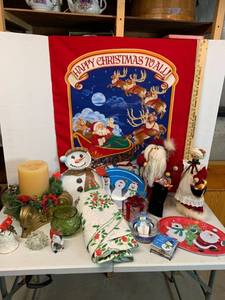lot 655 image: Holiday Decor - Santa & Mrs. Claus, Trays, Large Candle on stand, porcelain bell, Banner, Table cover