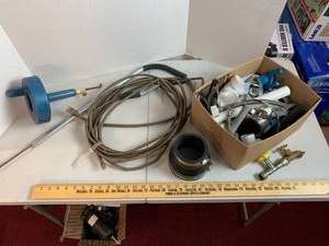 lot 708 image: Plumbing parts & clean out snakes
