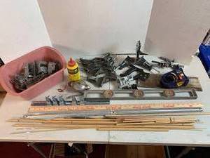 lot 713 image: Craftsman Corner clamps, Level, Wood Dowels, Wall bracket clamp holder, Chalkline & chalk, Hand saw, joist brackets