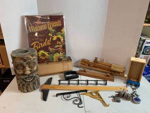 lot 724 image: Wall brackets, Nut Crackers, Wood project pieces, Solar powered Carved log style outdoor light, Metal sign, padlocks