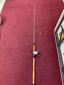 lot 743 image: Vintage Wood handle St. Croix Fishing Rod with Gamefish 12D Reel