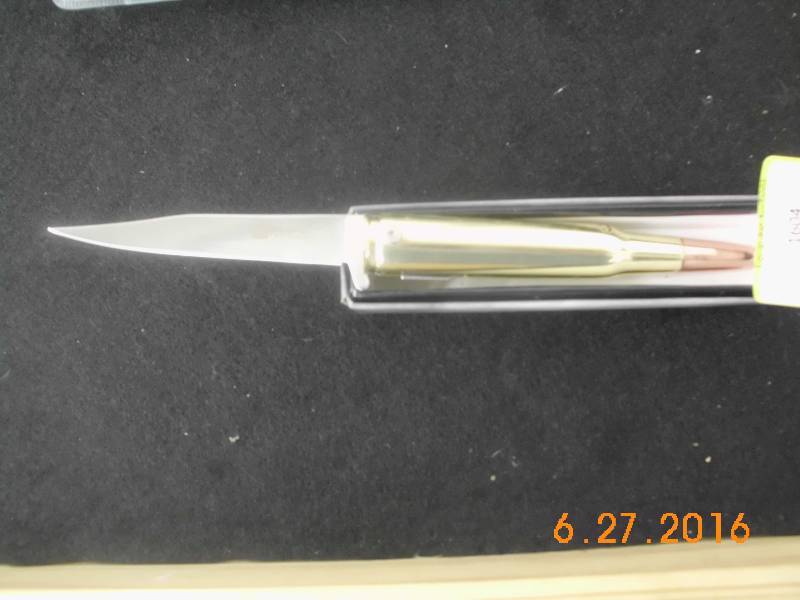 lot 1604 image: 50 Caliber Bullet Spring Assist Knife