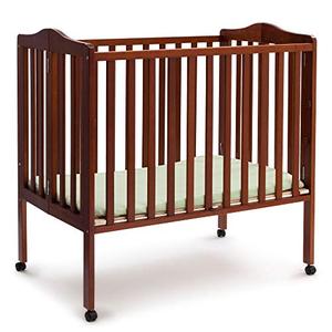 lot 26174 image: Delta Children Folding Portable Mini Baby Crib with 1.5-inch Mattress, Cherry