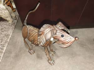 lot 1177 image: Metal palm leaf bobble head doggie decor approximately 13 in long