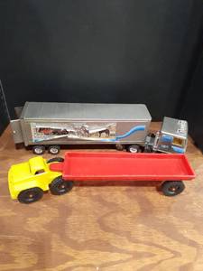 lot 6017 image: Toy trucks. One is metal and the other plastic